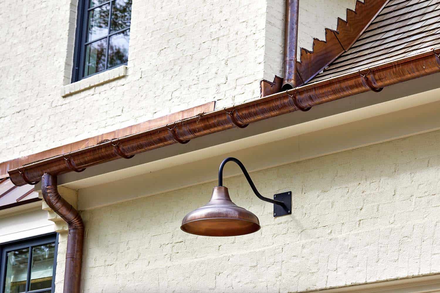 french-country-home-exterior-with-a-gooseneck-light